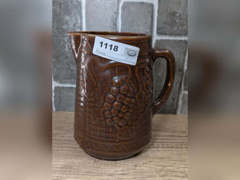 ANTIQUE NORTH STAR STONEWARE COMPANY PITCHER WITH A BROWN GLAZE AND A RAISED GRAPE AND TRELLIS DESIGN image