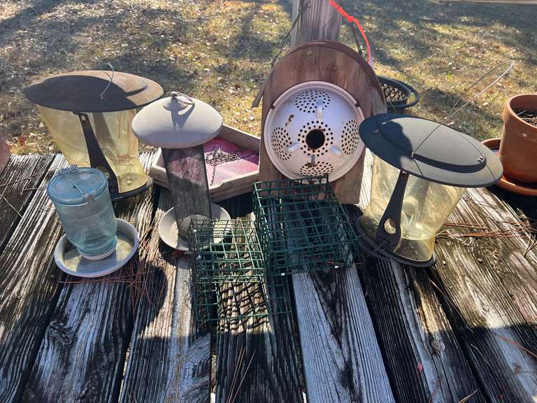 Back porch… Assortment of birdfeeders, also includes a custom folk art birdhouse, see pictures for details. image