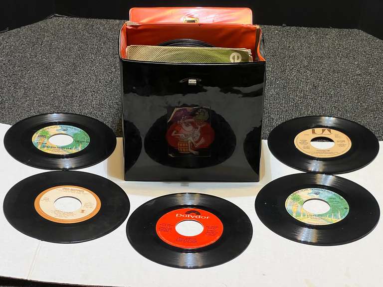 Assorted vintage 45’s with storage container, see pictures for details. image