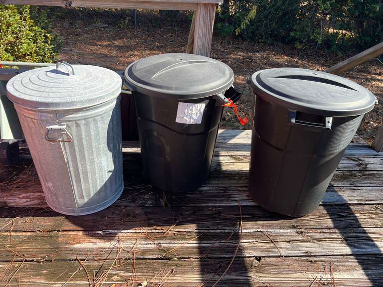 Back porch… Garbage cans, three pieces to include one metal can, see pictures for details. image