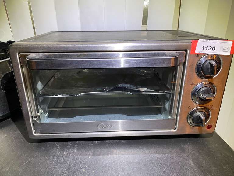DR…Oster toaster oven, powers up, see pictures for details. image