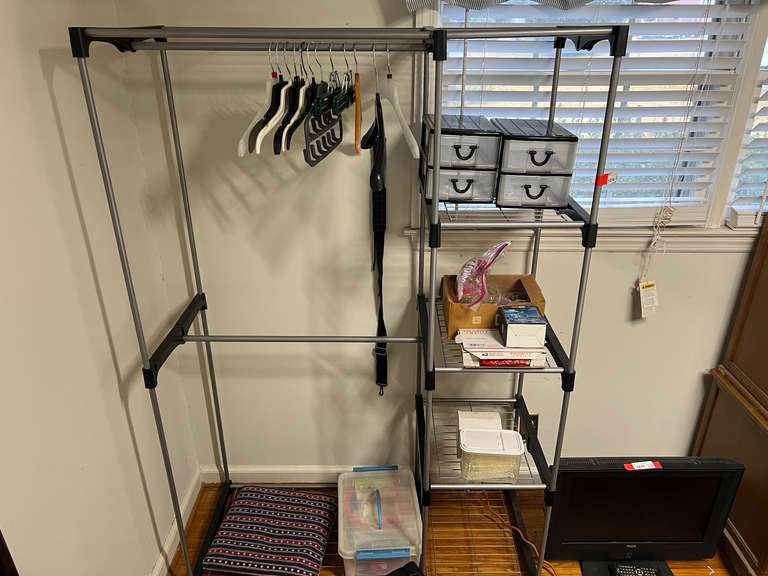 BR2…Clothing storage rack with some content, see pictures for details. image