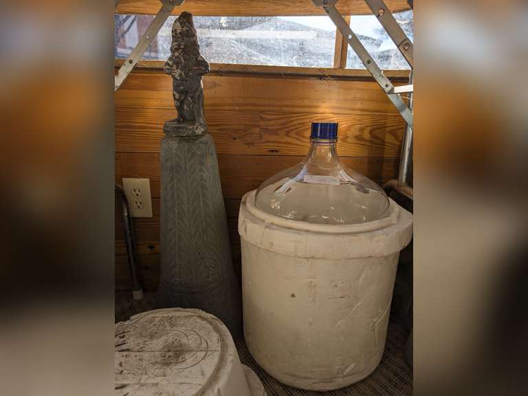 VERY LARGE WINE MAKING JUG WITH STYROFOAM CASE PLUS ANTIQUE CAST STONE GNOME AND PEDESTAL YARD ART image