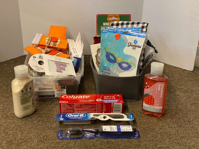 Assorted toiletries and crafting items, includes body wash, wine bottle bag, toothbrushes, toothpaste, and much more. Tubs are not included, see pictures for details.