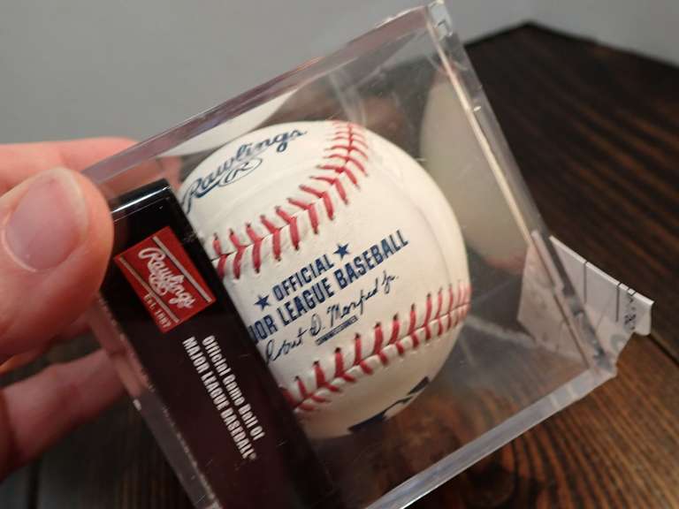 AUTOGRAPHED MAJOR LEAGUE BASEBALL IN DISPLAY CASE- APPEARS TO BE HANDSIGNED BY NOMAR MAZARA