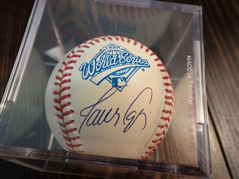 AUTOGRAPHED 1995 WORLD SERIES BASEBALL IN DISPLAY CASE - APPEARS TO BE SIGNED BY JAVIER LOPEZ
