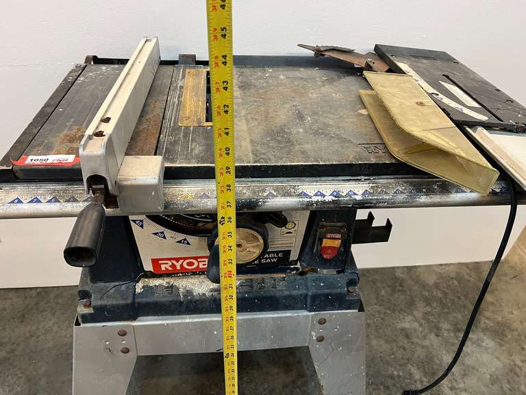 Ryobi 10” table saw with stand, comes with blade cover, and fence. Powers up, take CAUTION, switch is stuck in the on position, see pictures for details.