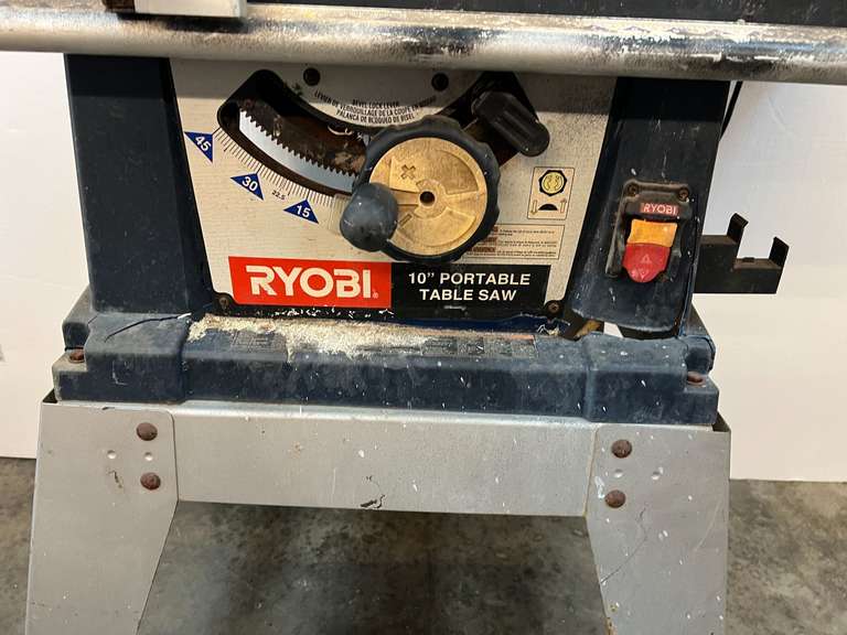 Ryobi 10” table saw with stand, comes with blade cover, and fence. Powers up, take CAUTION, switch is stuck in the on position, see pictures for details.