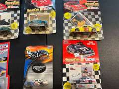 Large assortment of diecast cars, all pieces are unopened, ￼ includes Hot Wheels and Racing Champions, tub is NOT included, see pictures for details.