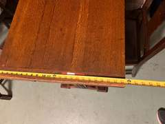 DEN… Antique slide leaf table, believed to be oak, the leaves on this unique piece slide forward under the table surface. Comes with four chairs, see pictures for details.