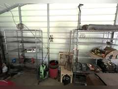 Bay 1 (house)…Two 6-shelf metal wire storage racks with content, also includes content between shelving units. Items include an electric pressure washer, box fan, flat shovel, battery charger, orbital hand sander, dovetail joint fixture, and more. See pictures for details.
