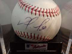 AUTOGRAPHED MAJOR LEAGUE BASEBALL IN DISPLAY CASE- APPEARS TO BE HANDSIGNED BY NOMAR MAZARA
