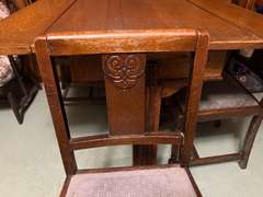 DEN… Antique slide leaf table, believed to be oak, the leaves on this unique piece slide forward under the table surface. Comes with four chairs, see pictures for details.