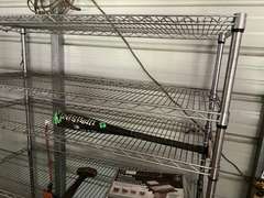 Bay 1 (house)…Two 6-shelf metal wire storage racks with content, also includes content between shelving units. Items include an electric pressure washer, box fan, flat shovel, battery charger, orbital hand sander, dovetail joint fixture, and more. See pictures for details.