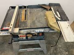 Ryobi 10” table saw with stand, comes with blade cover, and fence. Powers up, take CAUTION, switch is stuck in the on position, see pictures for details.
