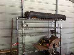 Bay 1 (house)…Two 6-shelf metal wire storage racks with content, also includes content between shelving units. Items include an electric pressure washer, box fan, flat shovel, battery charger, orbital hand sander, dovetail joint fixture, and more. See pictures for details.