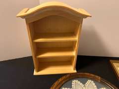 BR1…Assorted home decor to include miniature wall mount curio, framed doily, and more.