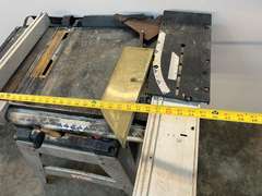 Ryobi 10” table saw with stand, comes with blade cover, and fence. Powers up, take CAUTION, switch is stuck in the on position, see pictures for details.