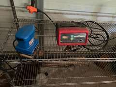 Bay 1 (house)…Two 6-shelf metal wire storage racks with content, also includes content between shelving units. Items include an electric pressure washer, box fan, flat shovel, battery charger, orbital hand sander, dovetail joint fixture, and more. See pictures for details.