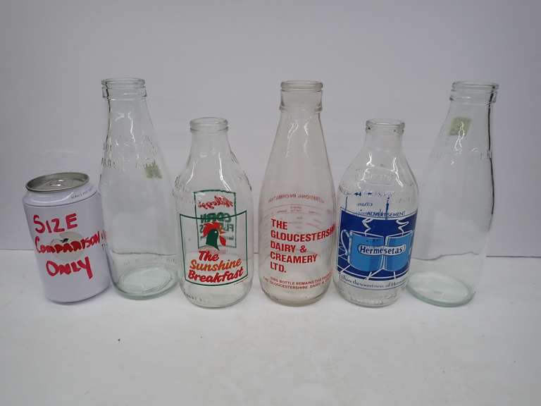 Collection of Vintage Glass Bottles with Advertising