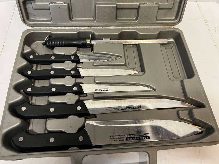 Cutting board with knife set, comes in storage/carrying case, see pictures for details.