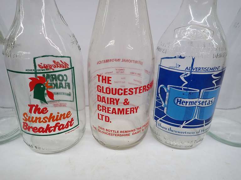 Collection of Vintage Glass Bottles with Advertising