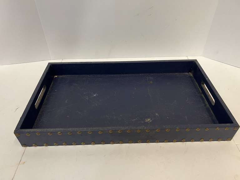 Leather look serving tray with nail head trim, see pictures for details.