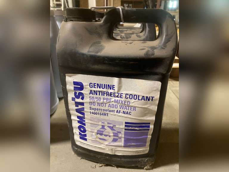 (4) 1 GALLON JUGS KOMATSU COOLANT - PARTS
