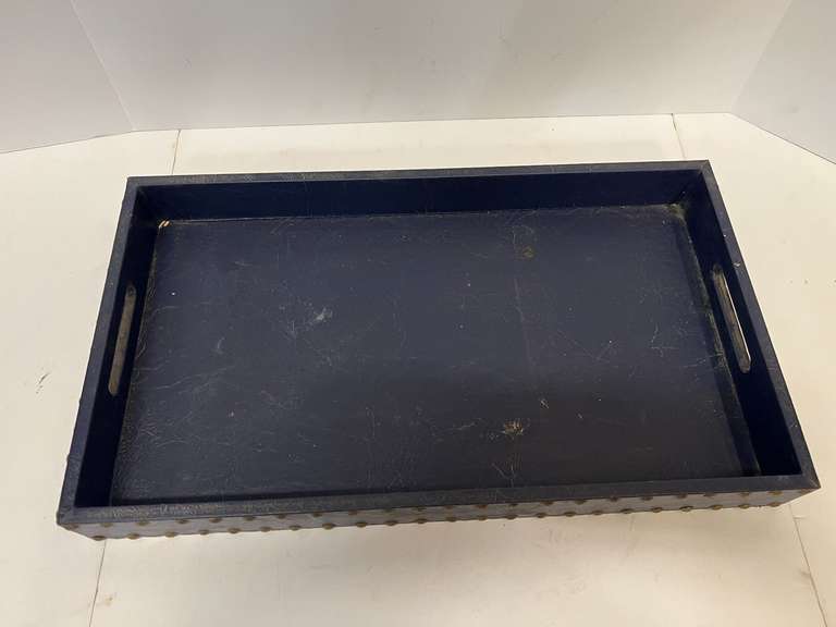 Leather look serving tray with nail head trim, see pictures for details.