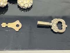Vintage advertising clicker for Calvert Canadian whiskey, also includes vintage rhinestone buttons, clock key, and vintage address holder, see pictures for details.