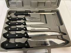 Cutting board with knife set, comes in storage/carrying case, see pictures for details.