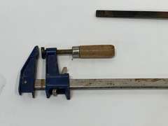 Metal bar clamp, also includes a small Dewalt trigger clamp, see pictures for details.