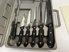 Cutting board with knife set, comes in storage/carrying case, see pictures for details.
