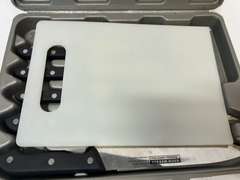Cutting board with knife set, comes in storage/carrying case, see pictures for details.