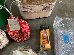 Mystery lot of assorted household goods to include return vent cover, fasteners, alarm clock projector, floor register, and much more. See pictures for details.