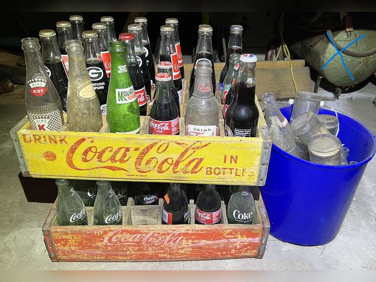 Vintage Coca-Cola crates, set of two, includes assorted commemorative Coca-Cola’s, vintage bottles, and more. See pictures for details. image