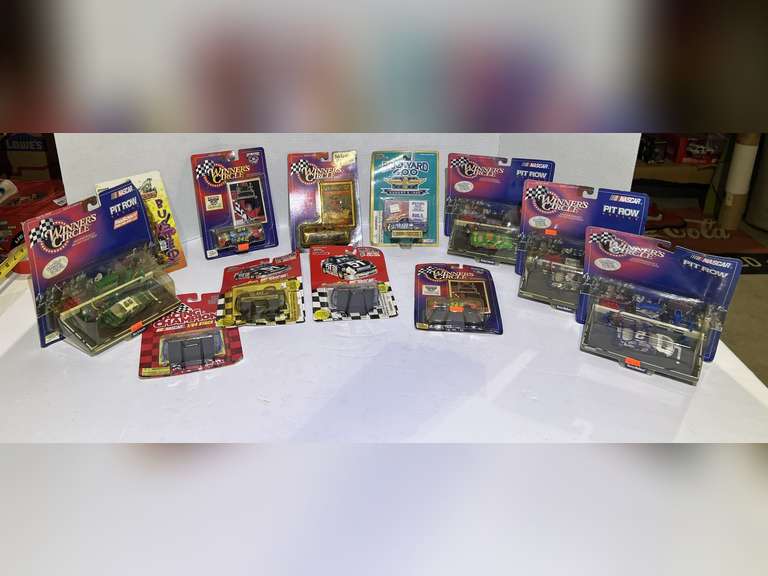 Basket of assorted diecast stock car replicas, and more. Still in original packaging, see pictures for details. image