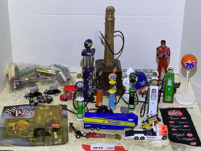 Large assortment of diecast vintage gas pumps, Dale Earnhardt figurine, diecast cars, And much more. See pictures for details. image