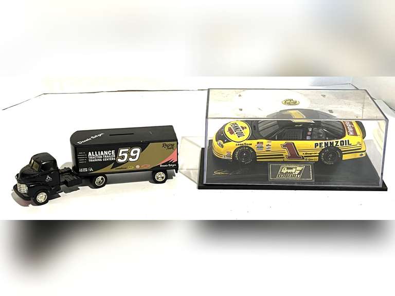 Diecast race car replica with display case, also includes a diecast transport coin bank, see pictures for details. image