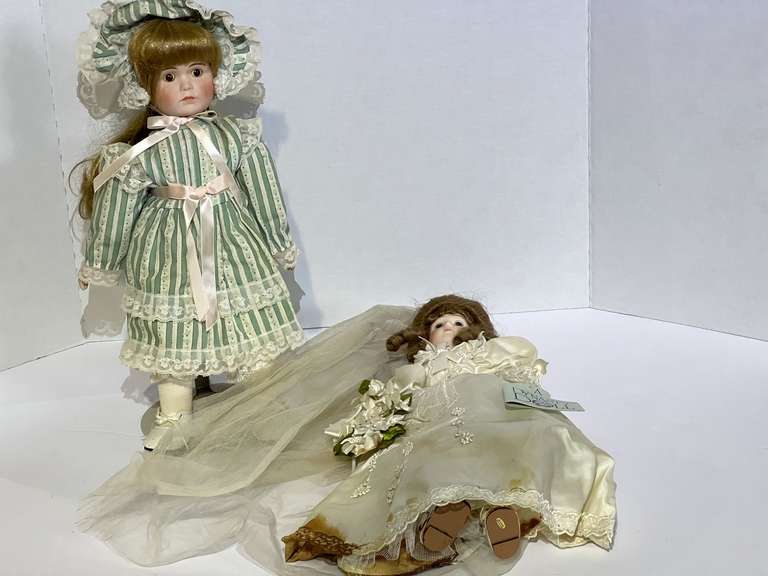 Collectible dolls, two pieces, one with stand, see pictures for details. image