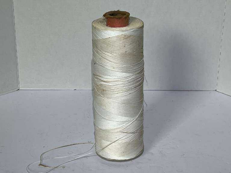 Large spool of machine twist thread, see pictures for details. image