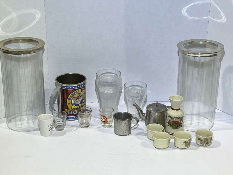 Assorted items to include Coca-Cola glassware, Japanese sake set with carafe and four sake cups, racing themed shot glasses, and more. See pictures for details. image