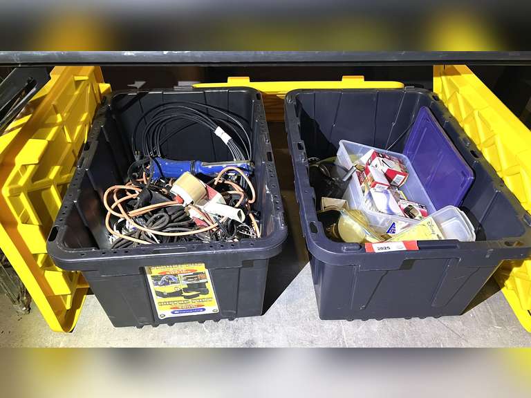 Large assortment of household items to include lightbulbs, floodlights, extension cords, drop lights, tape dispenser, and more. See pictures for details. image