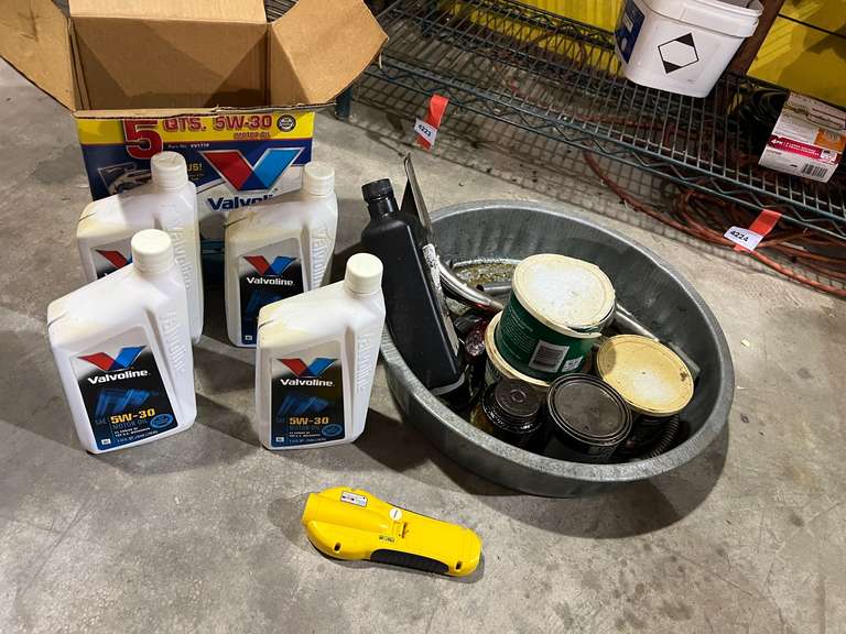 Assortment of car maintenance items such as oil, grease, and more. See pictures for details. image