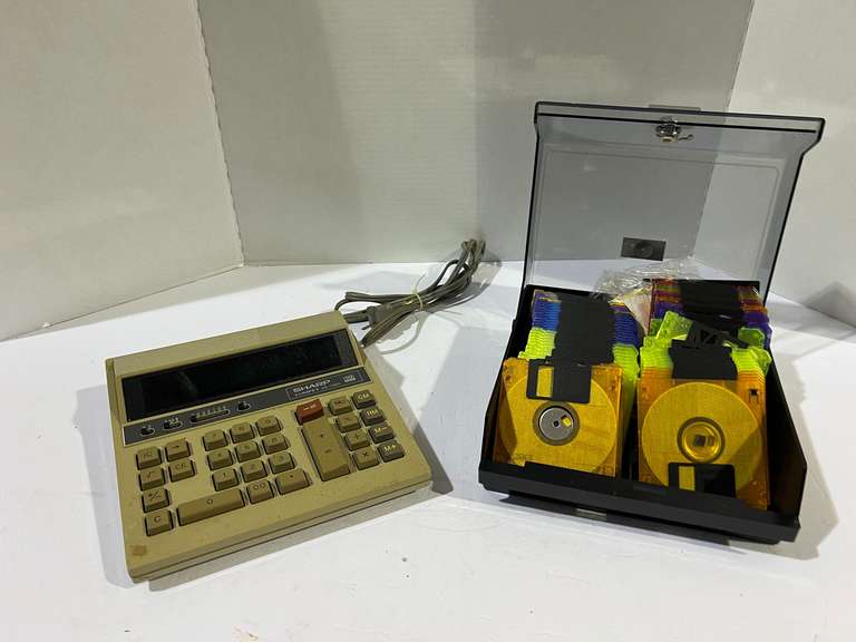 Sharp Compet QS – 1122A adding machine, working condition unknown, also includes diskette files with storage case, see pictures for details. image