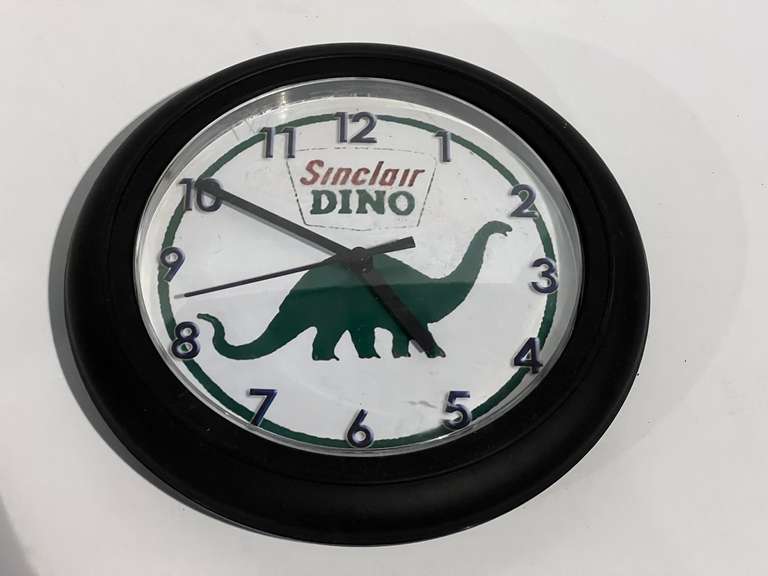 Sinclair “Dino” battery operated wall clock, see pictures for details. image