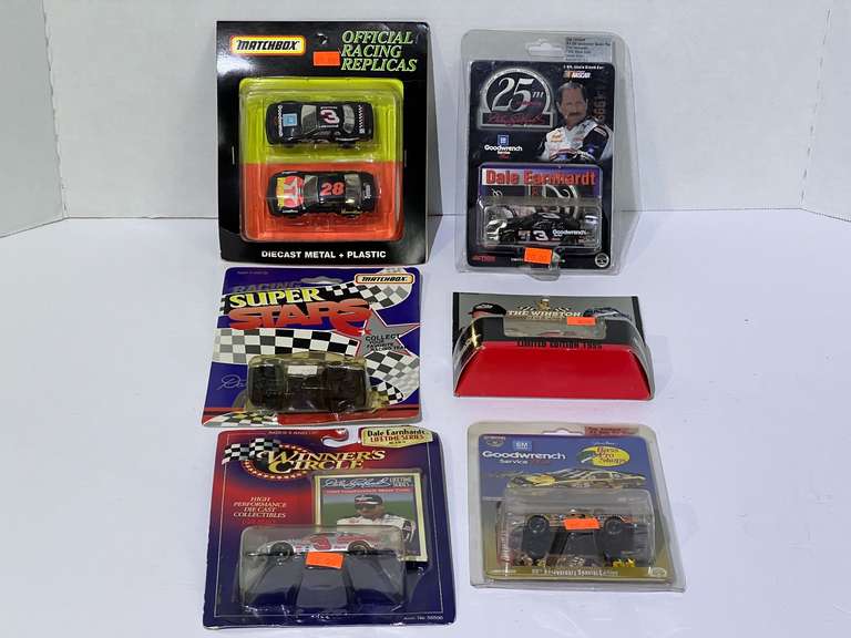 Assorted diecast stock car miniature replicas, featuring Dale Earnhardt, and Davie Allison, seven pieces, all pieces are still in original packaging, see pictures for details. image