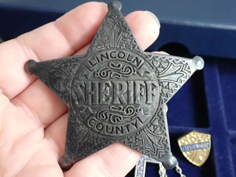 COIN COLLECTOR BOX & CONTENTS - INCLUDES HEAVY METAL SHERIFF BADGE, CROSS NECKLACE, C-5 AIR FORCE MEDALLION & MORE