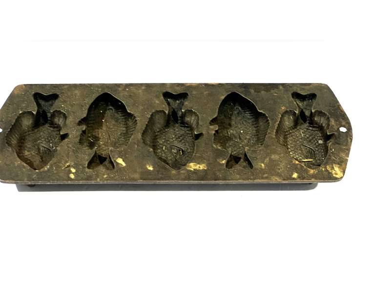 Lodge cast-iron “fish” pan, see pictures for details. image