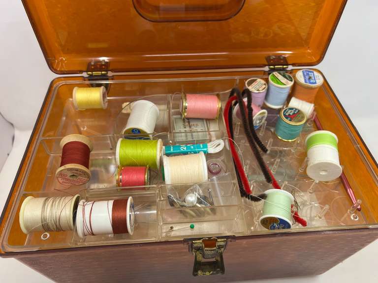 LR… Plastic sewing box with light content, see pictures for details.
